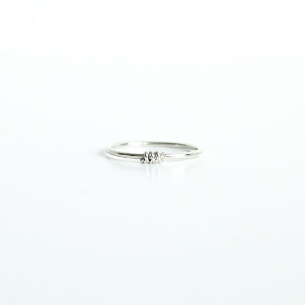 The Teeny Tiny ring is a dainty minimalistic style that's fun to wear and easy for stacking upon your favorite rings.